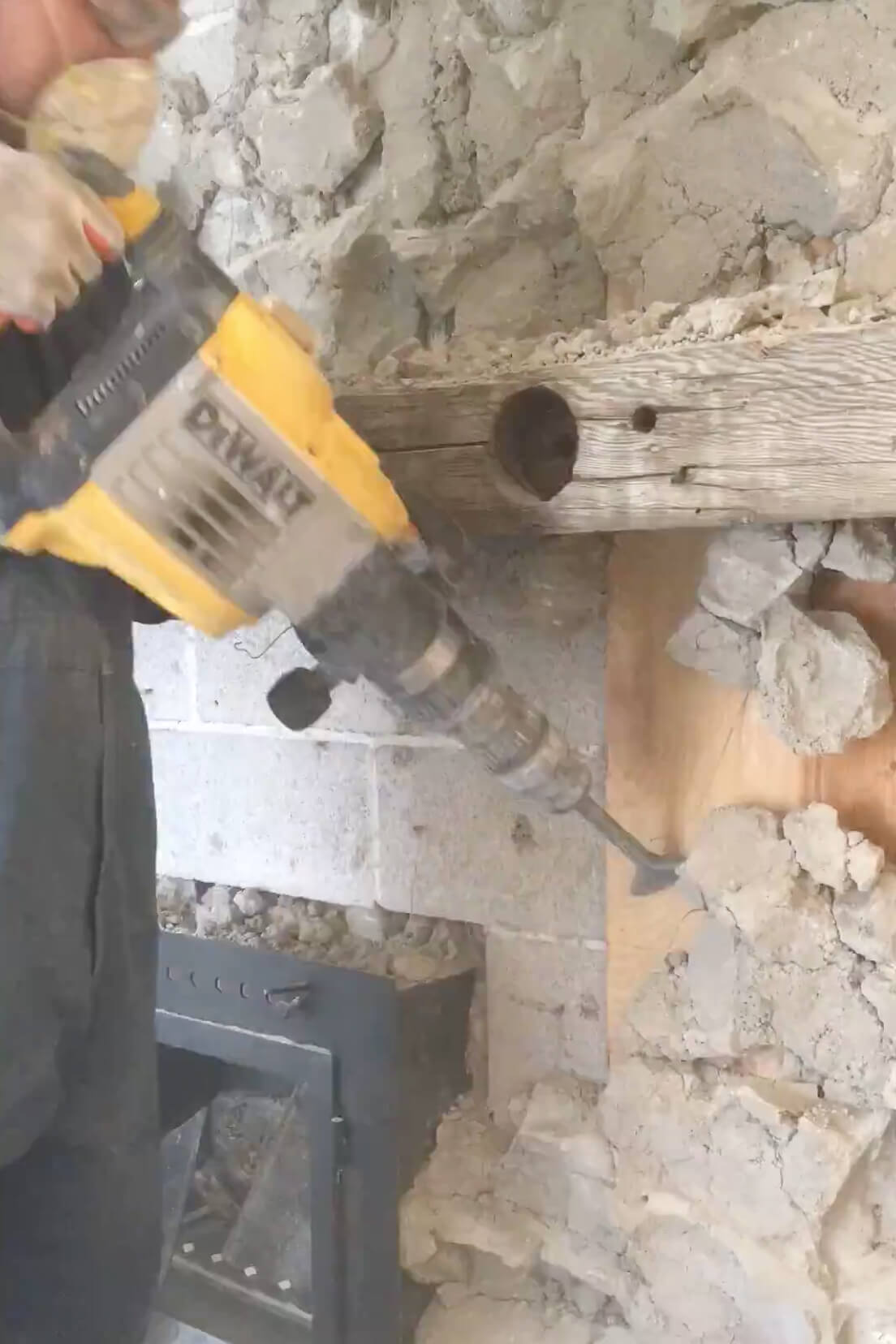 Ripping stone off of an old fireplace hearth.